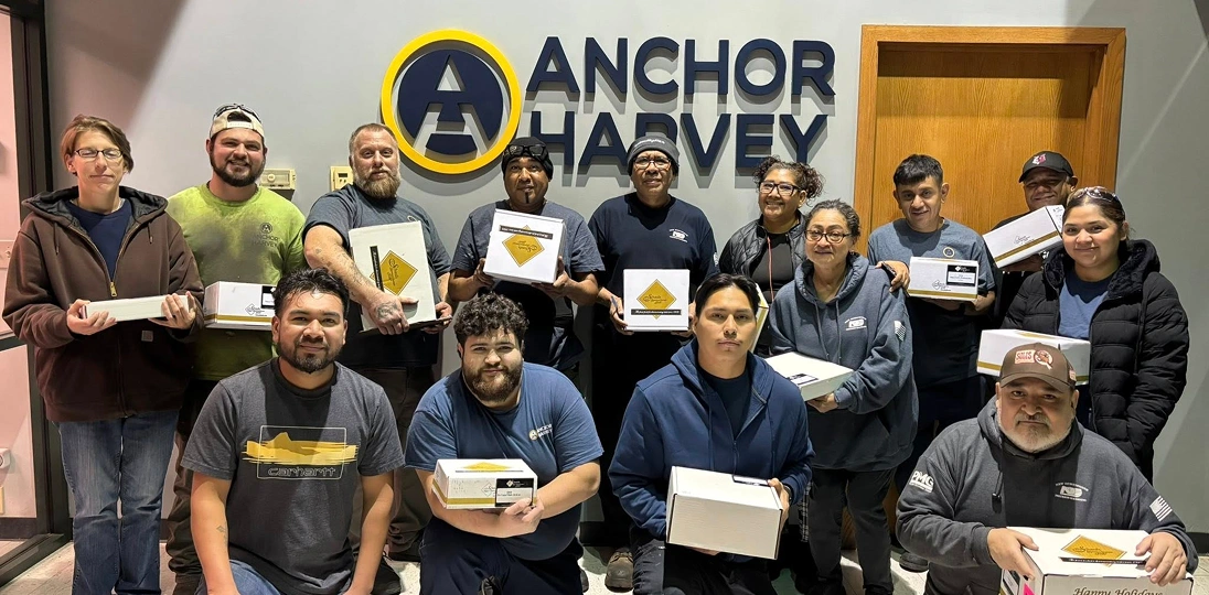 group of people face to camera holding certificates