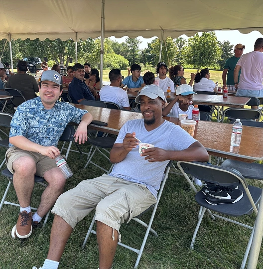 two individuals sitting on chair on a event